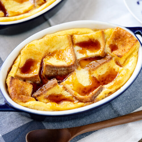A gratin dish containing Pan Pudding (Japanese Bread Pudding) topped with a caramel sauce.