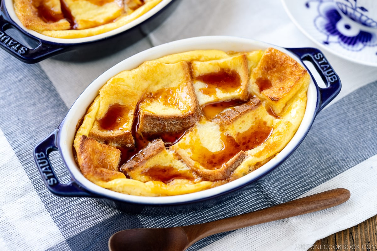 A gratin dish containing Pan Pudding (Japanese Bread Pudding) topped with a caramel sauce.