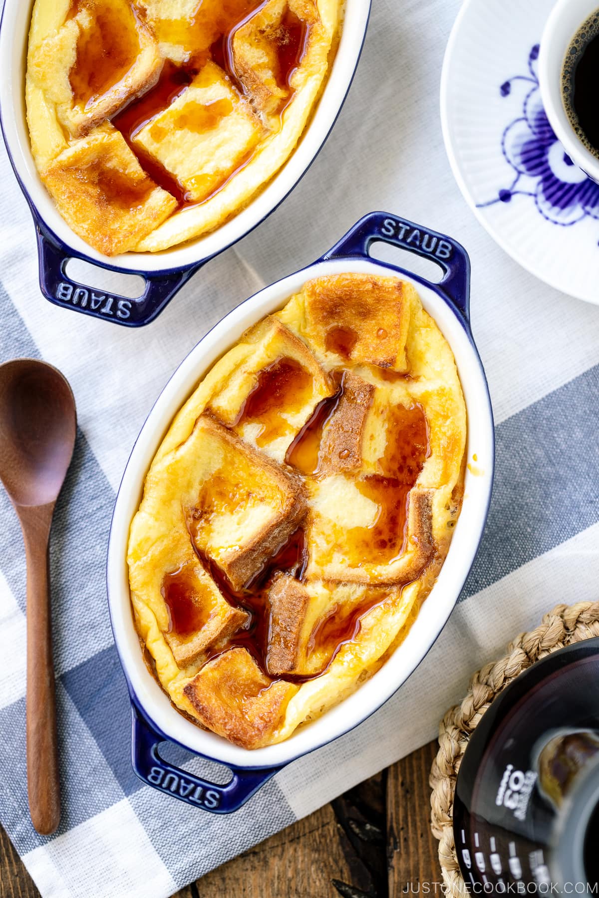 A gratin dish containing Pan Pudding (Japanese Bread Pudding) topped with a caramel sauce.