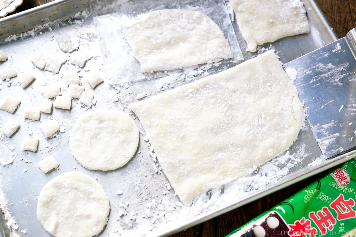 A baking sheet containing different forms of Gyuhi (Japanese soft mochi dough).