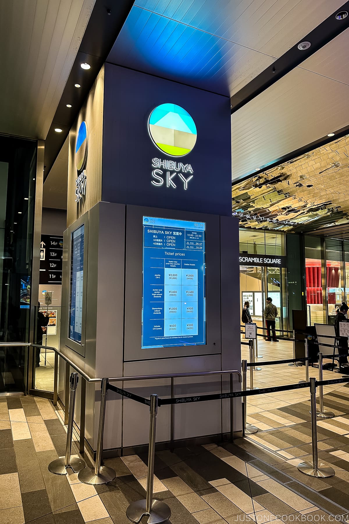 Shibuya Sky on a column with info on a screen below