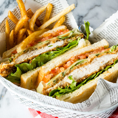 A basket containing Crispy Chicken Sandwich and french fries.