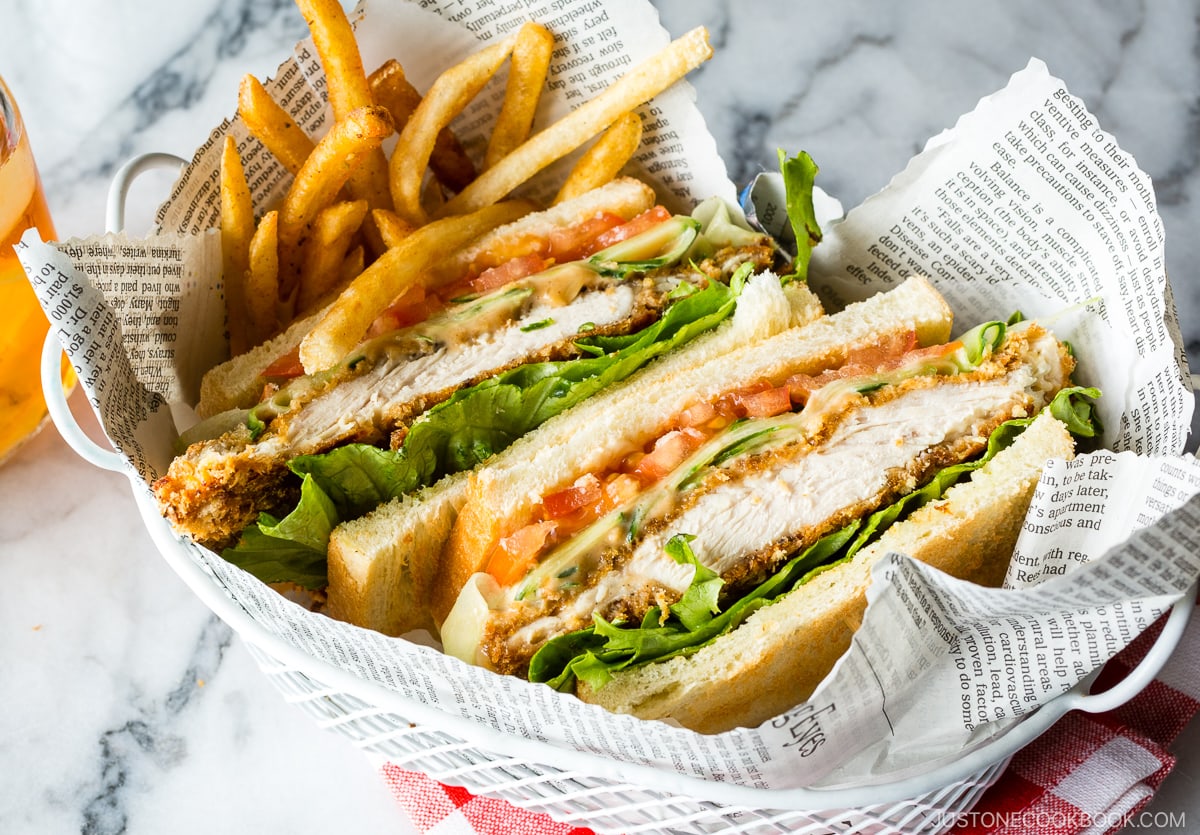 A basket containing Crispy Chicken Sandwich and french fries.