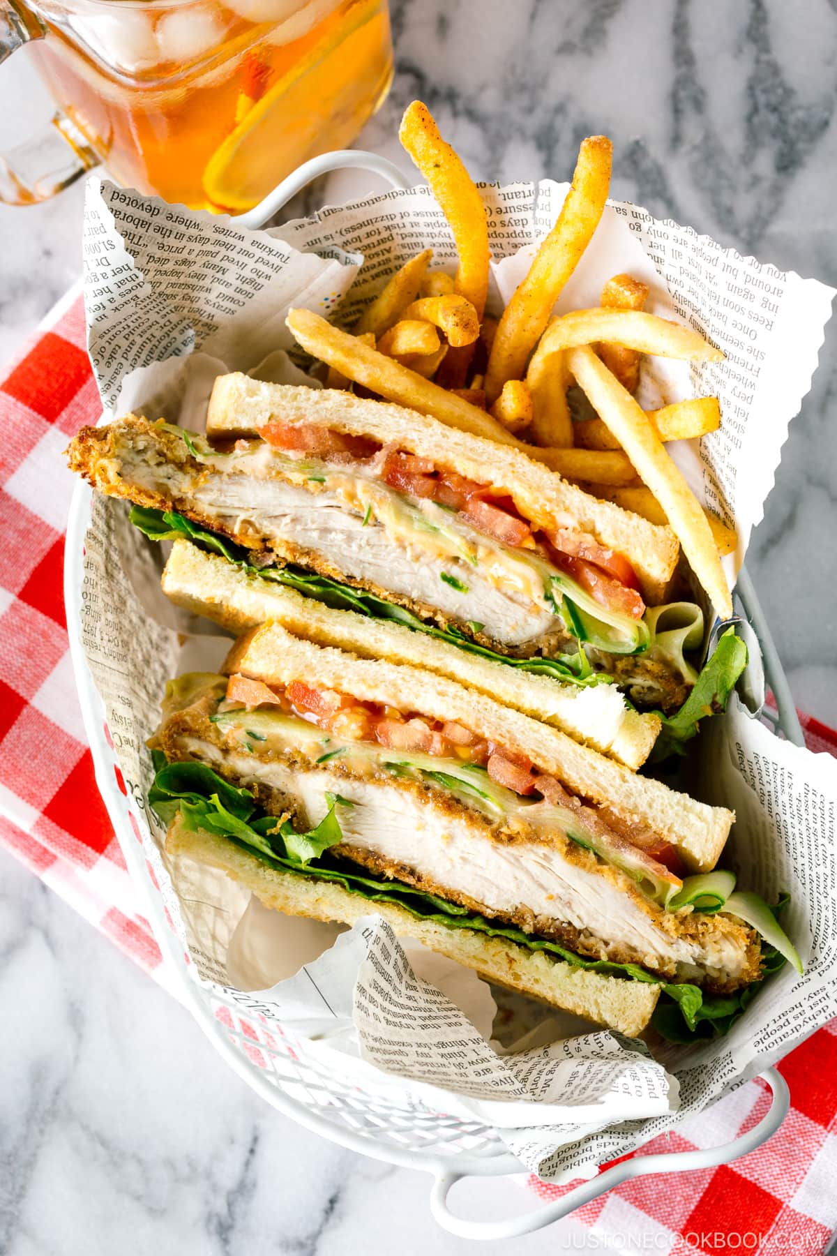 A basket containing Crispy Chicken Sandwich and french fries.