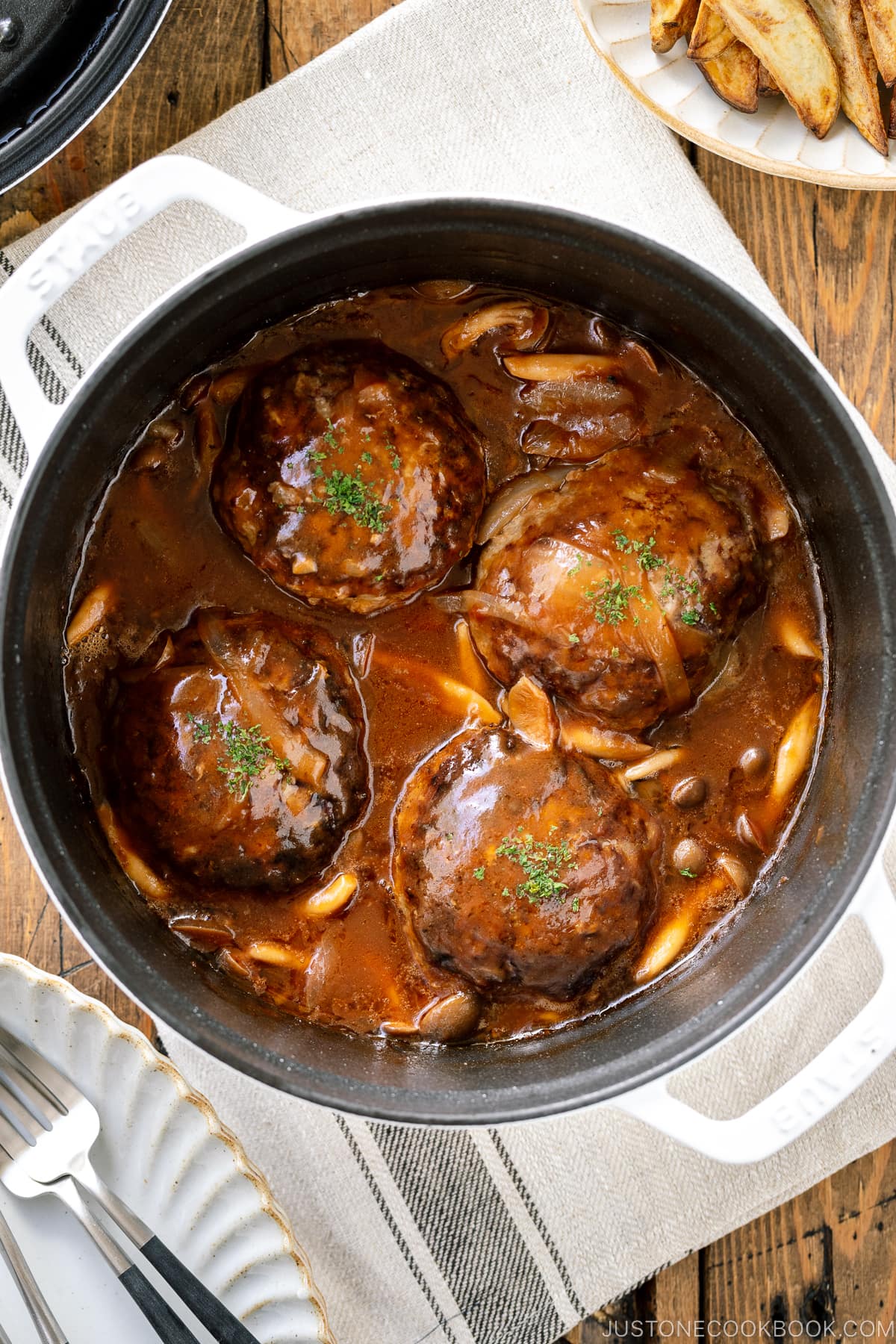 A white staub containing Japanese Stewed Hamburger Steak (Nikomi Hambagu).