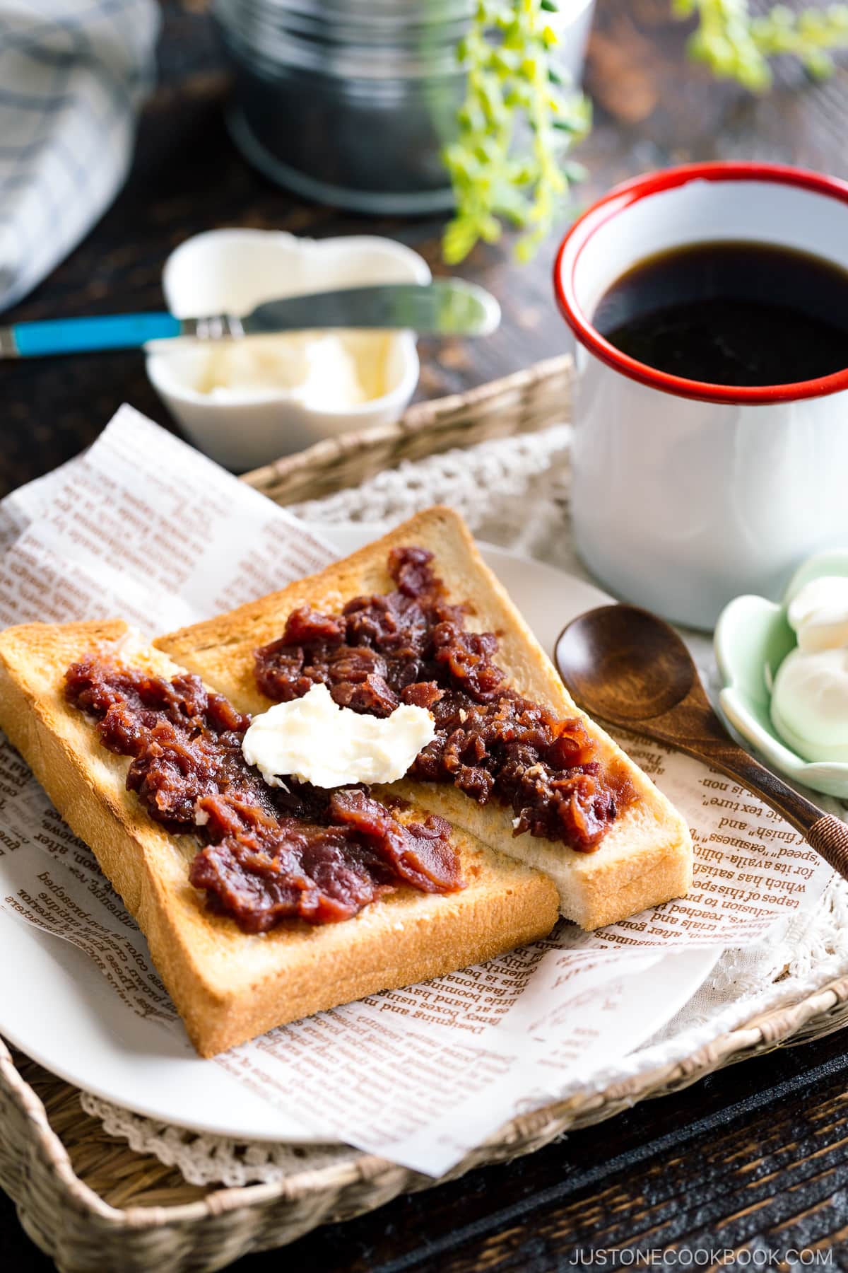 A Japanese shokupan toast topped with butter, sweet red bean paste, and fresh whipped cream.