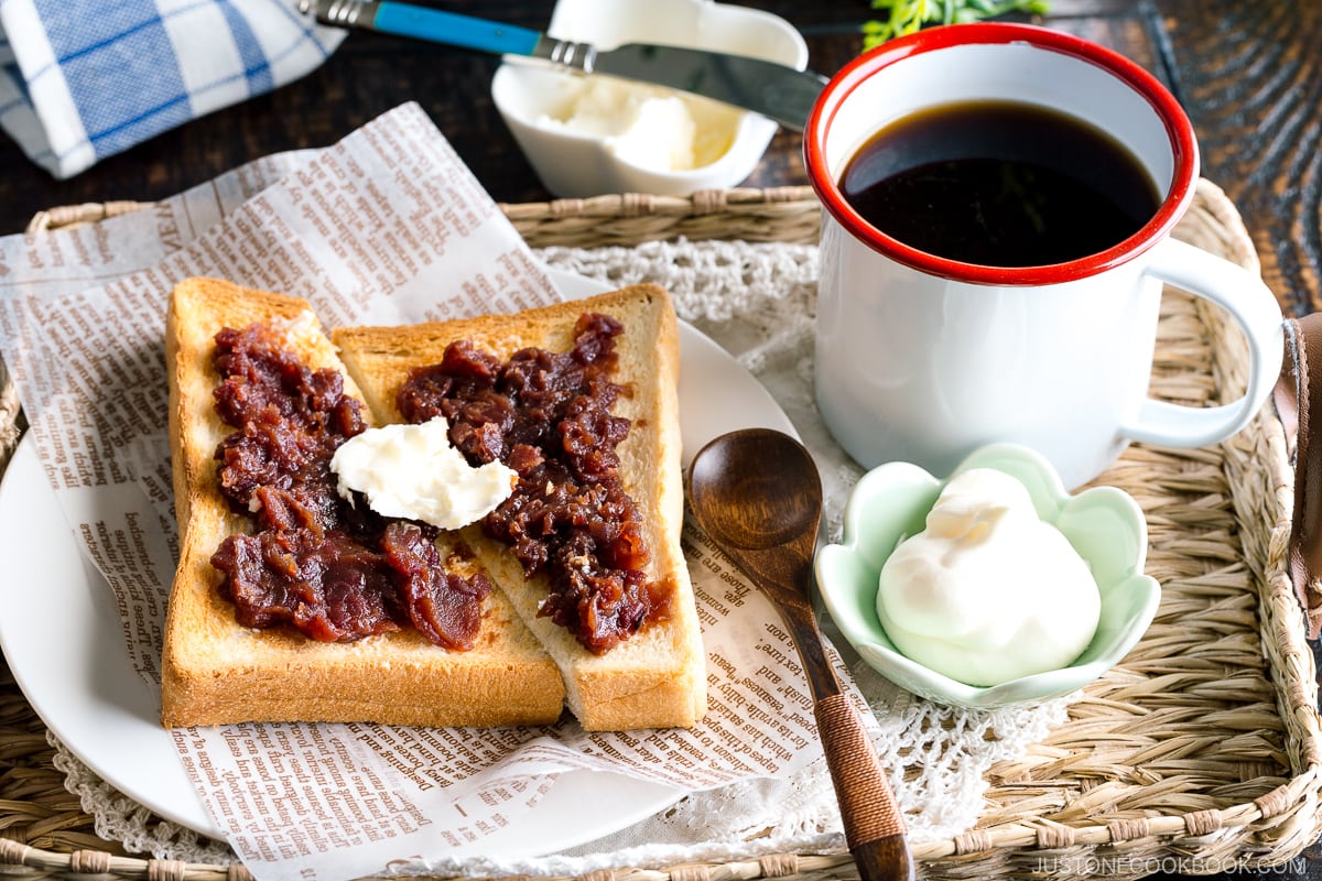A Japanese shokupan toast topped with butter, sweet red bean paste, and fresh whipped cream.