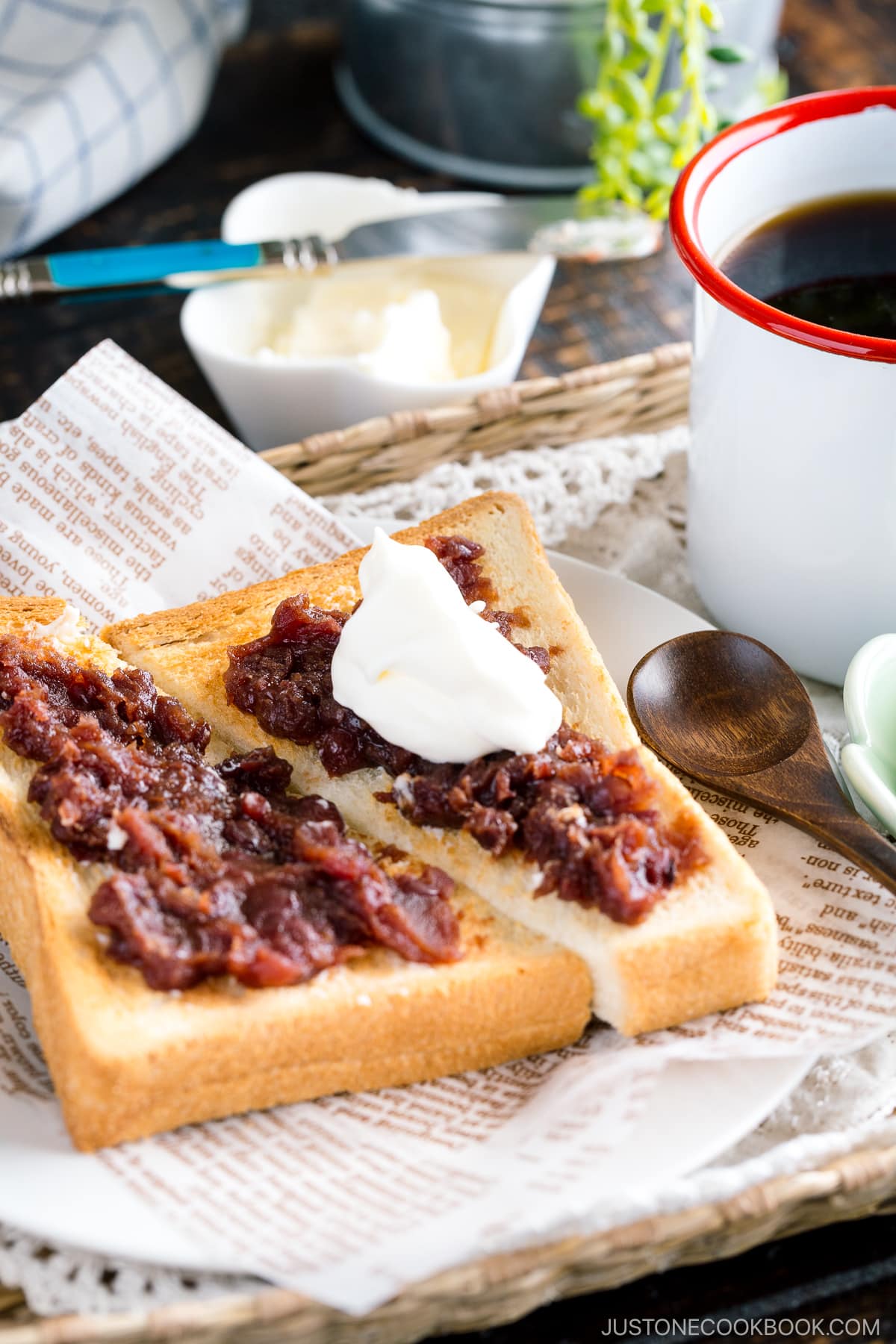 A Japanese shokupan toast topped with butter, sweet red bean paste, and fresh whipped cream.