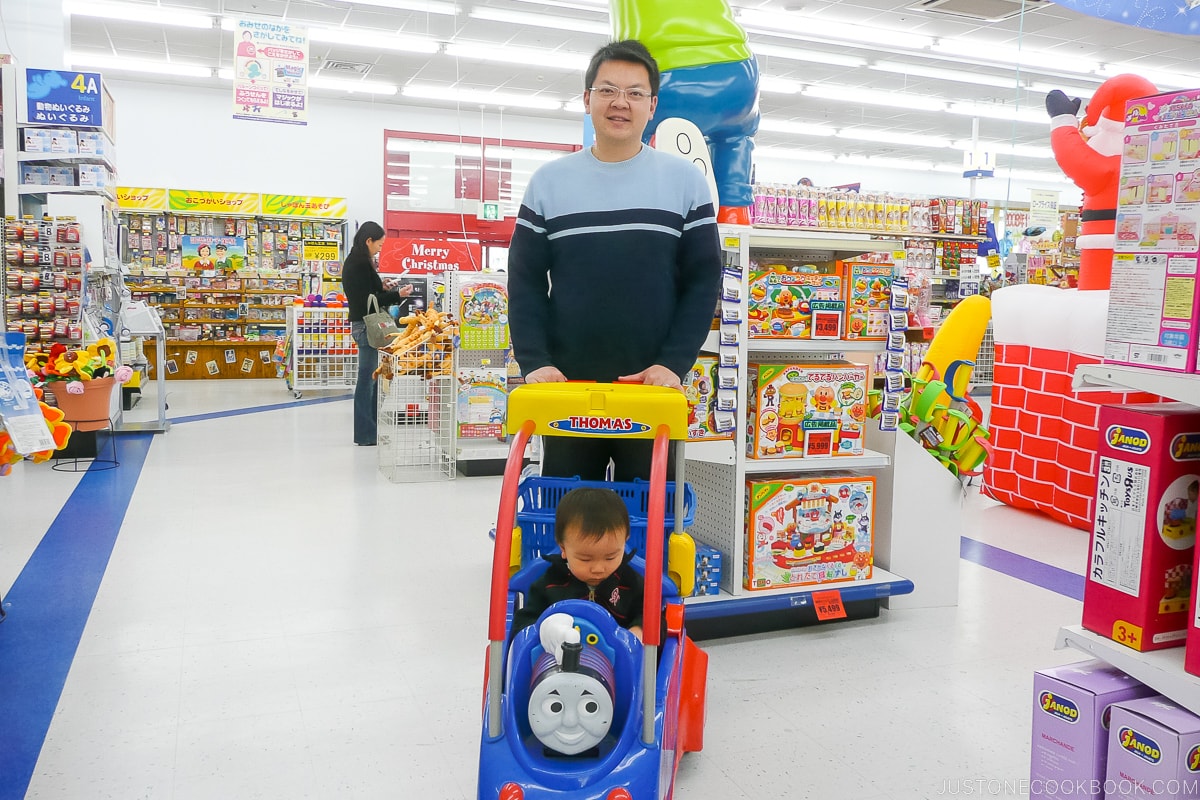 a man and a boy in a toy store