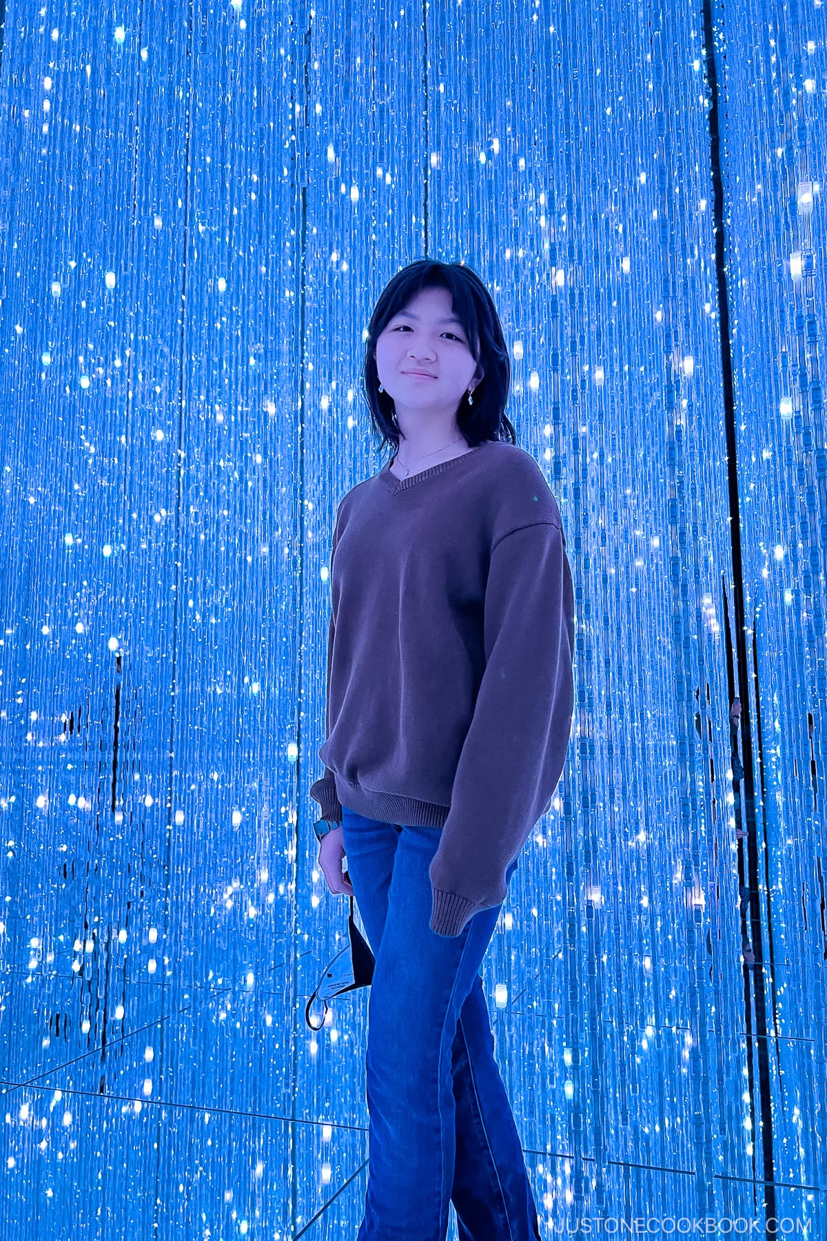 a girl standing in The Infinite Crystal Universe
