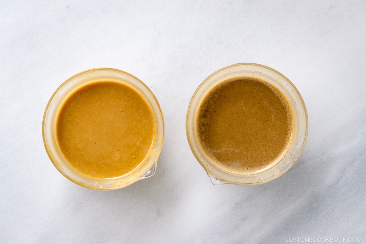 Glass bowls containing two types of Goma Dare (Japanese Sesame Sauce).