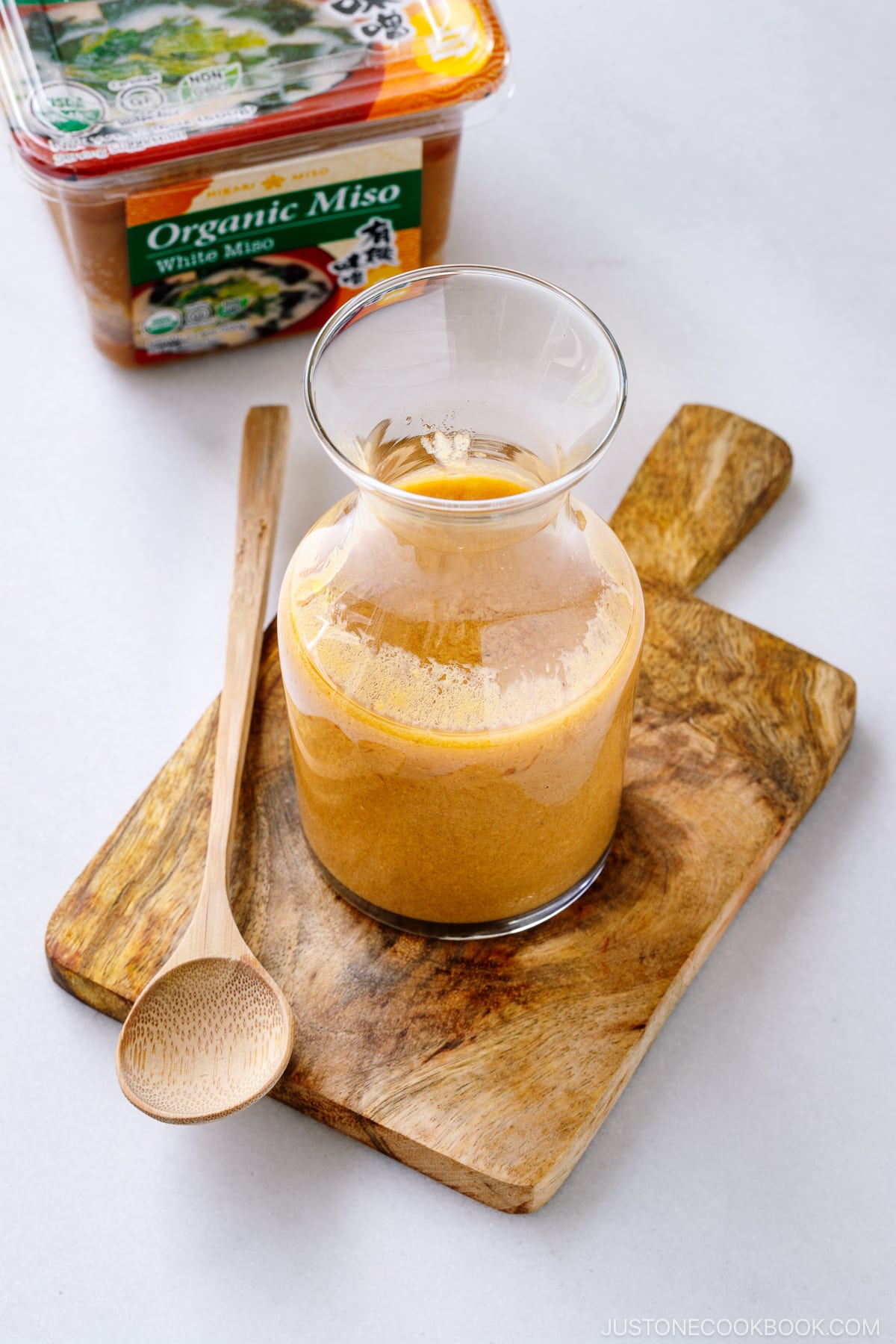 A glass jar containing homemade Miso Dressing.