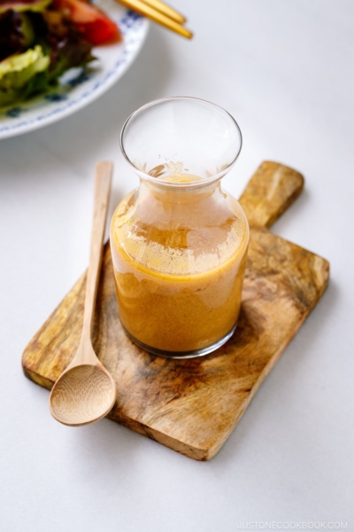 A glass jar containing homemade Miso Dressing.