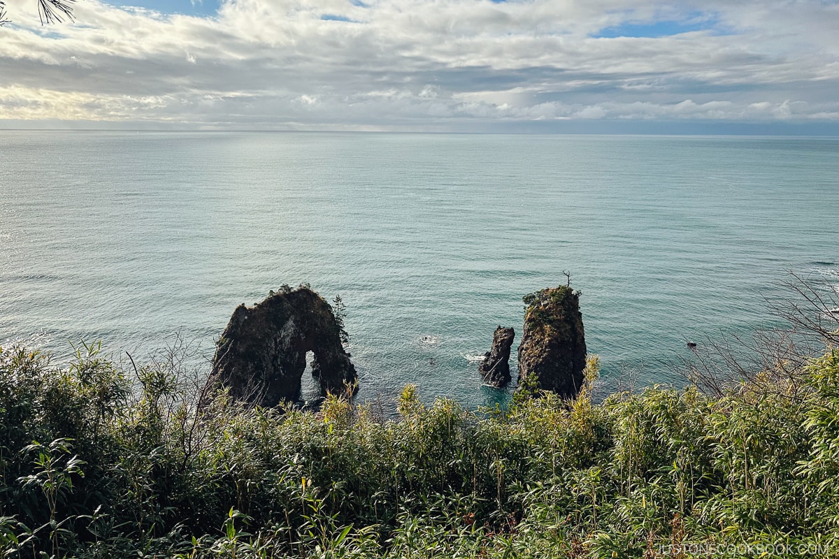 rock formation protruding from the ocean