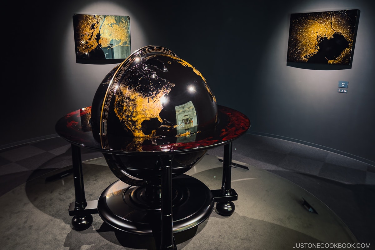 Lacquer globe in the center of the room on display