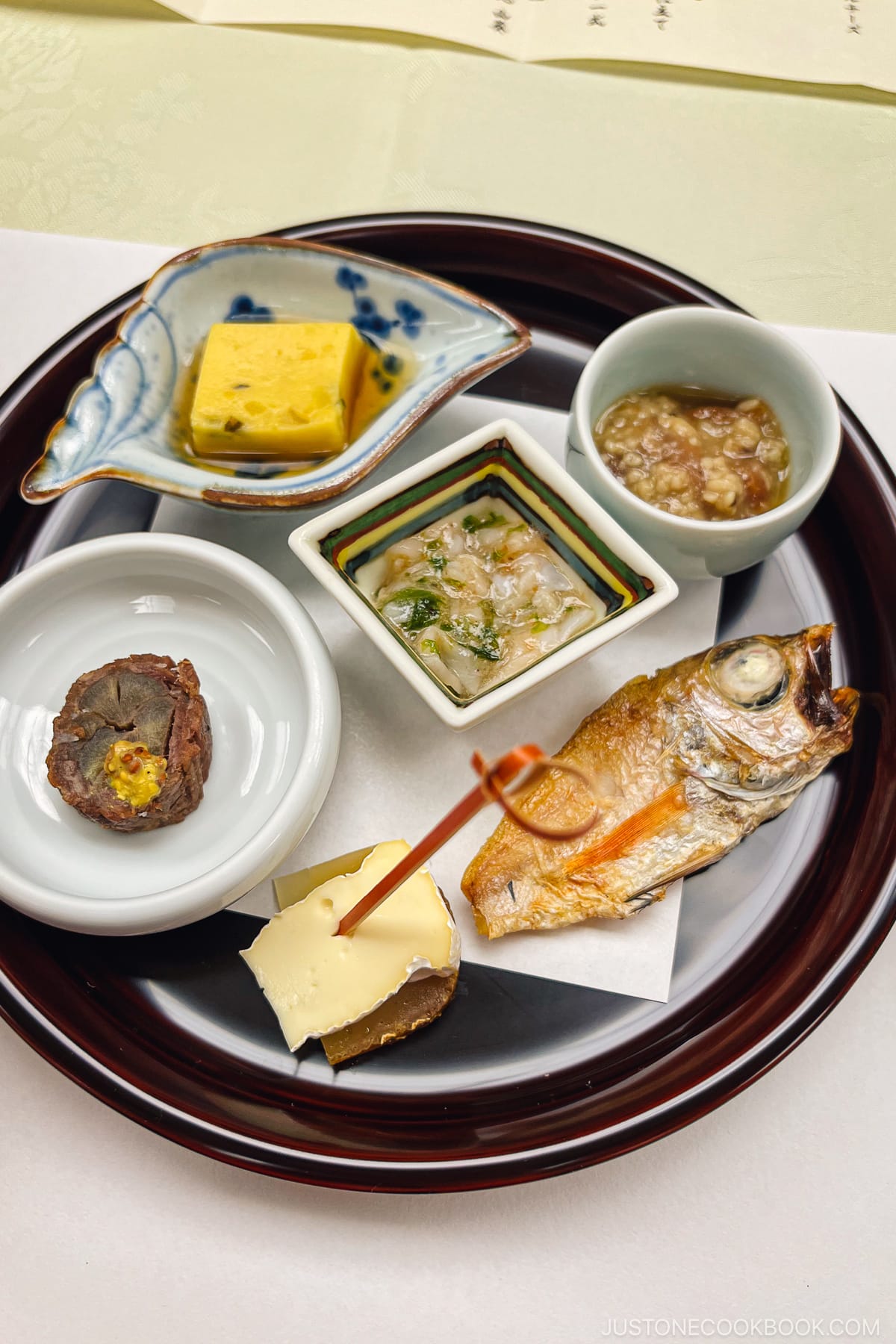 variety of dishes on a lacquer dish