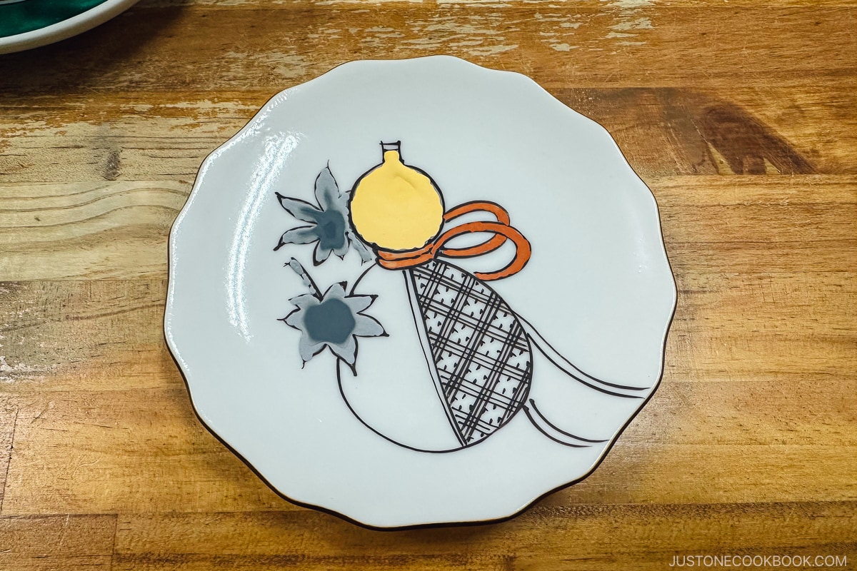 painted kutaniyaki porcelain plate on a table