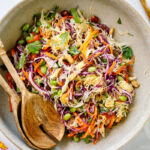 A large salad bowl containing Asian Cabbage Salad.