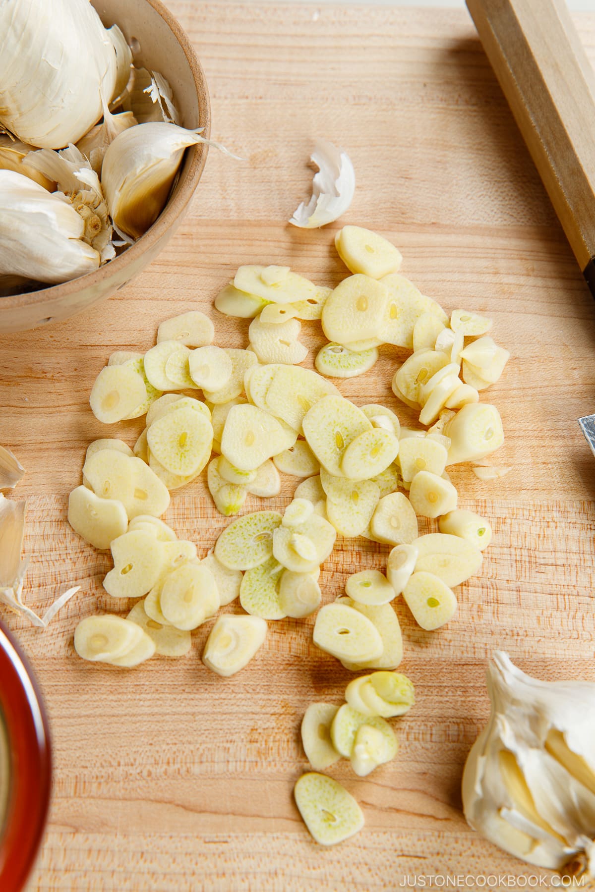 Sliced fresh garlic on the cutting board.