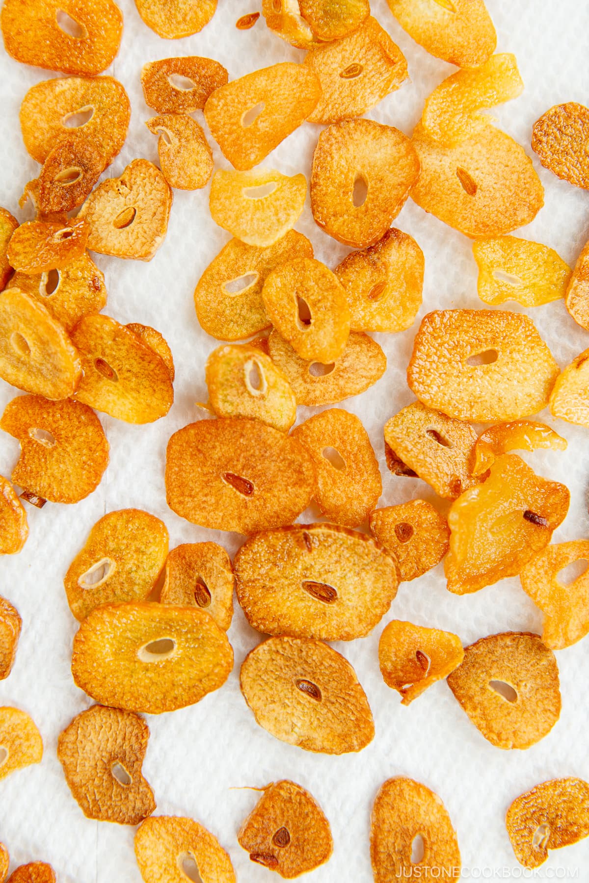 Golden fried garlic chips on the paper towel.