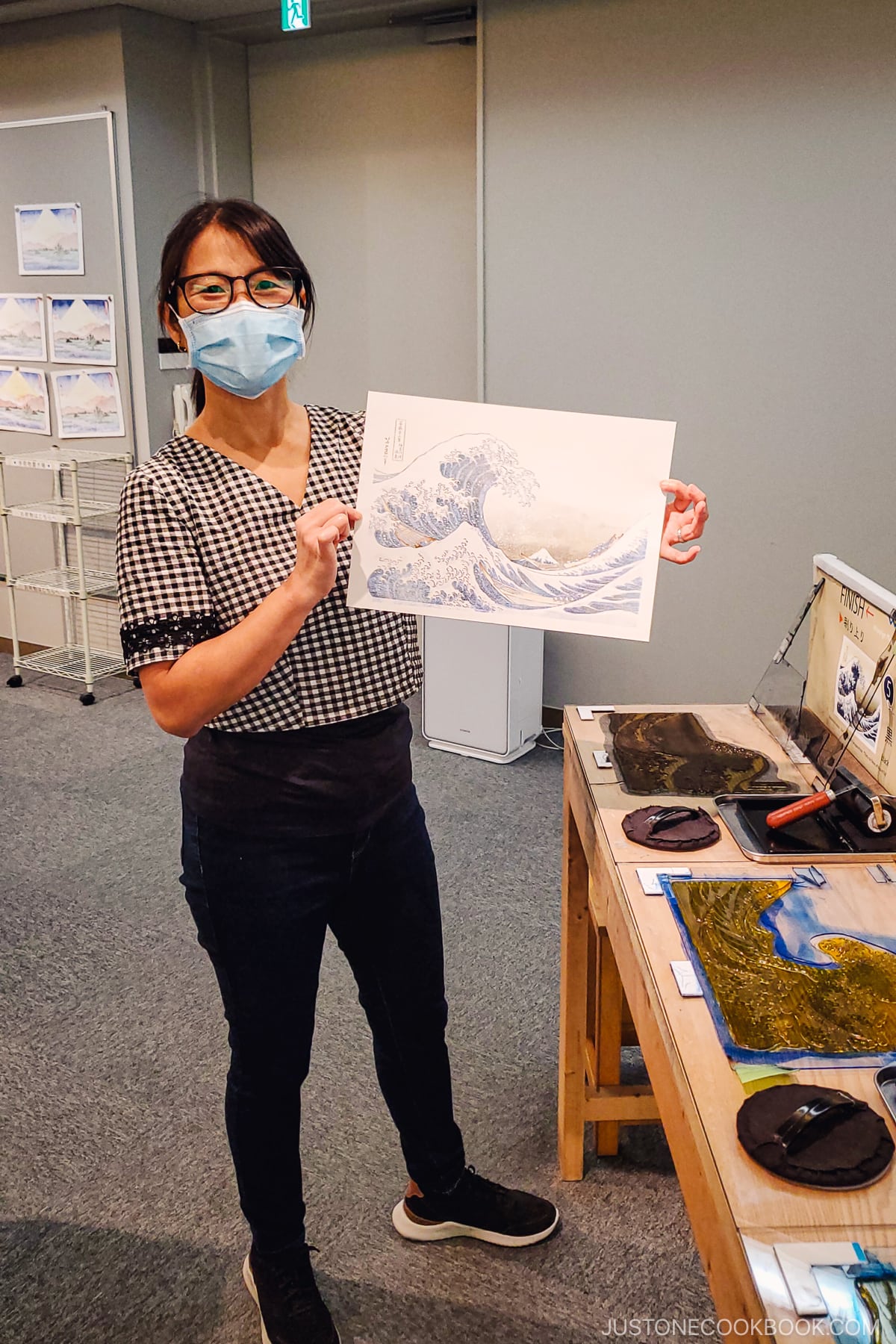 a women holding a woodblock printing