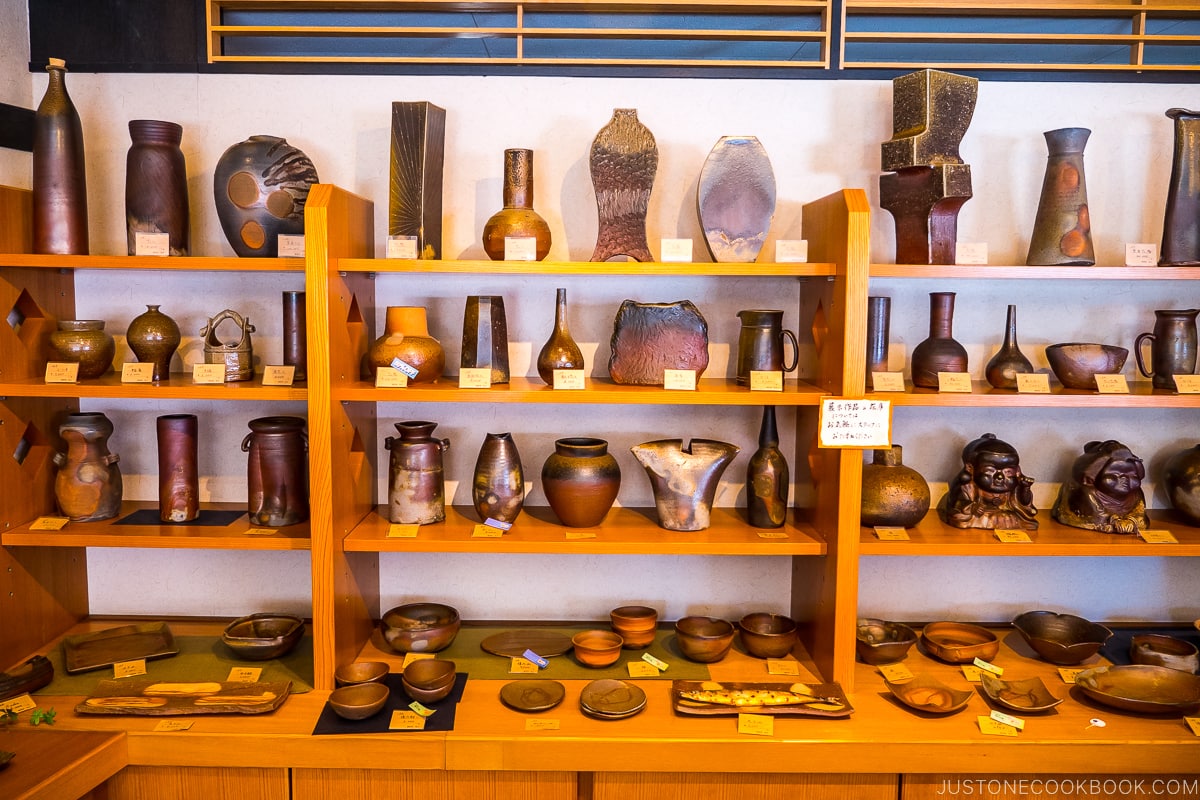 Bizen ware vases displayed on wood shelves