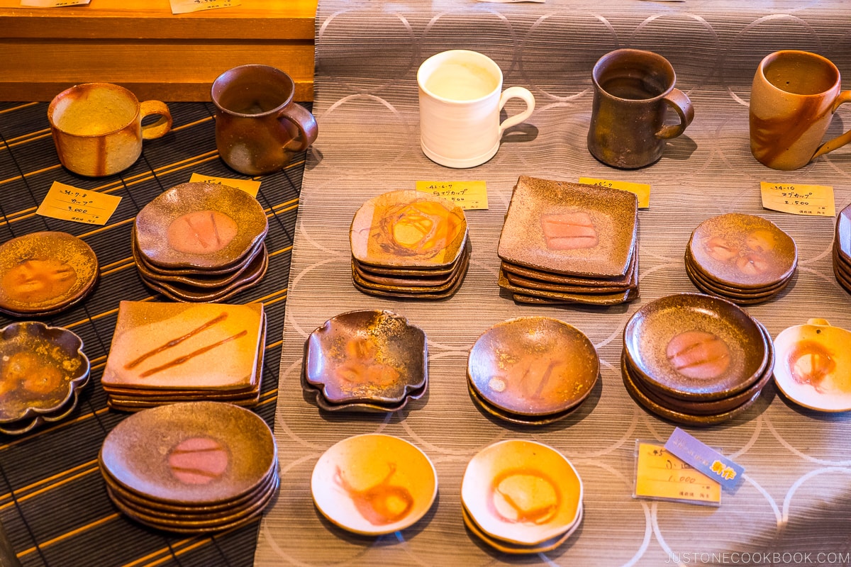 Bizen ware displayed on wood shelves