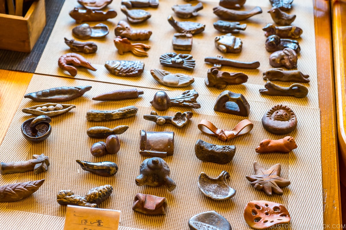 Bizen ware chopsticks holder displayed on wood shelves