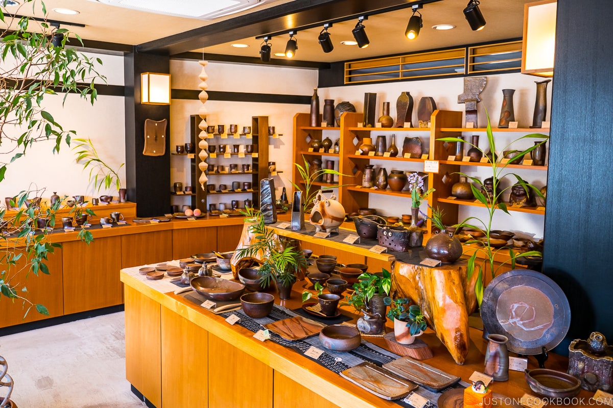 Bizen ware displayed inside a store on wood shelves