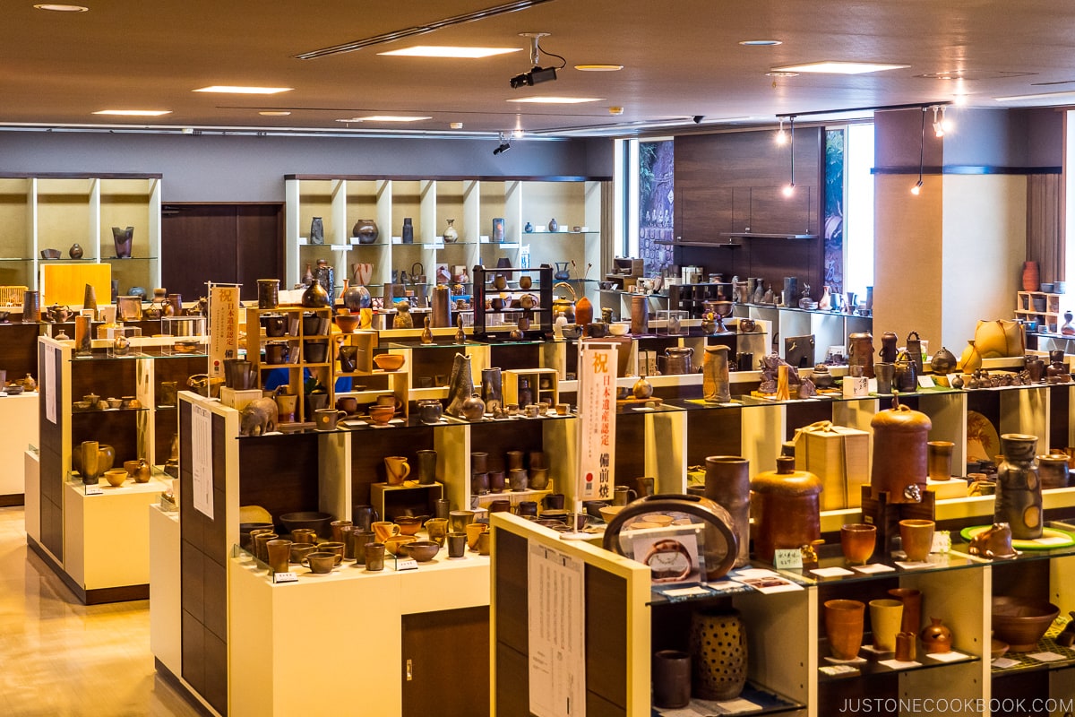 Bizen ware displayed on wood shelves