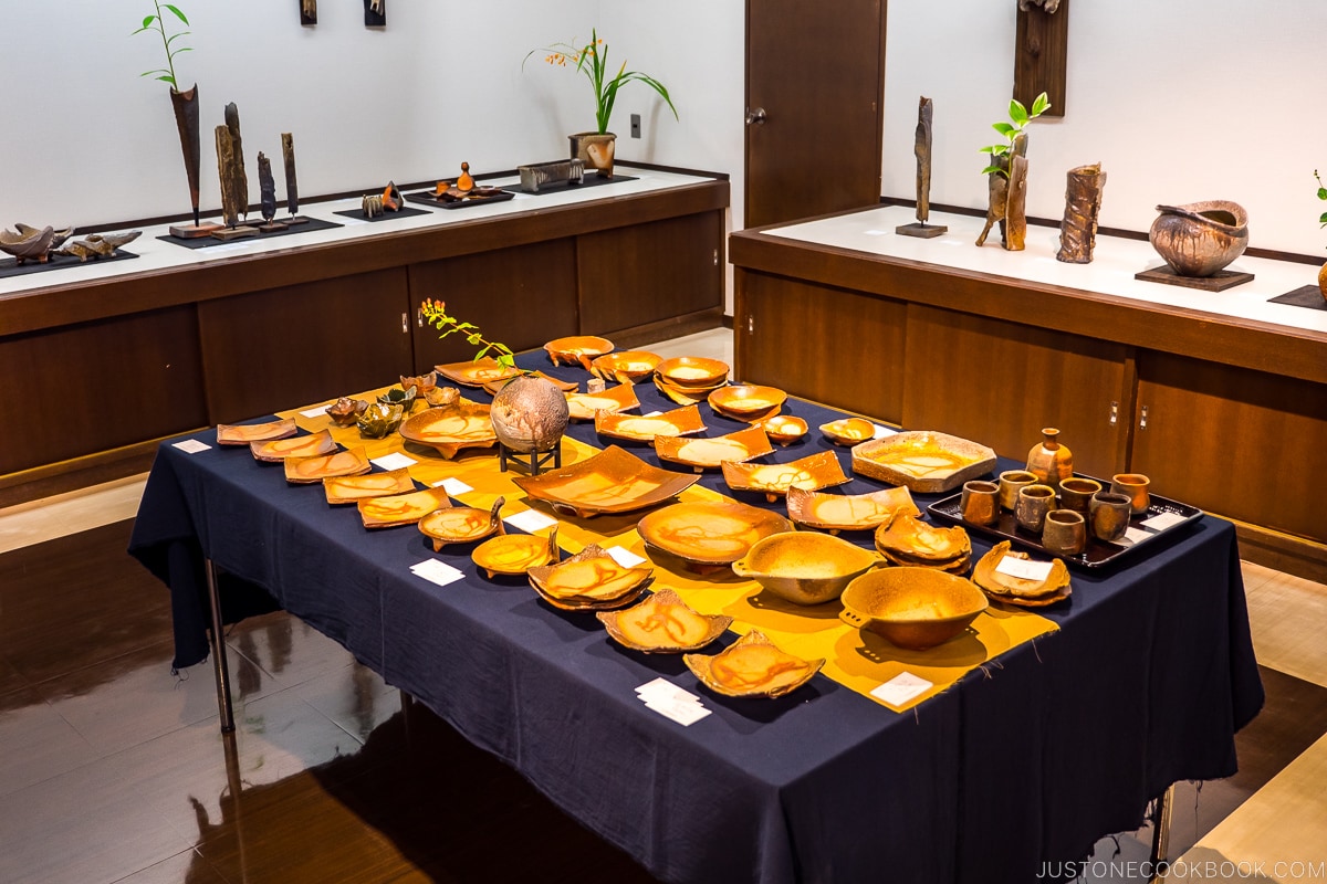 Bizen ware displayed on wood shelves