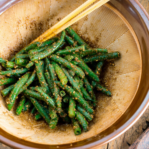 Blue and white Japanese bowls containing Green bean Gomaae.