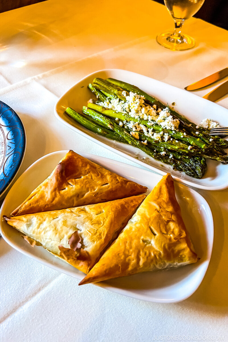grilled asparagus and pastry on plates