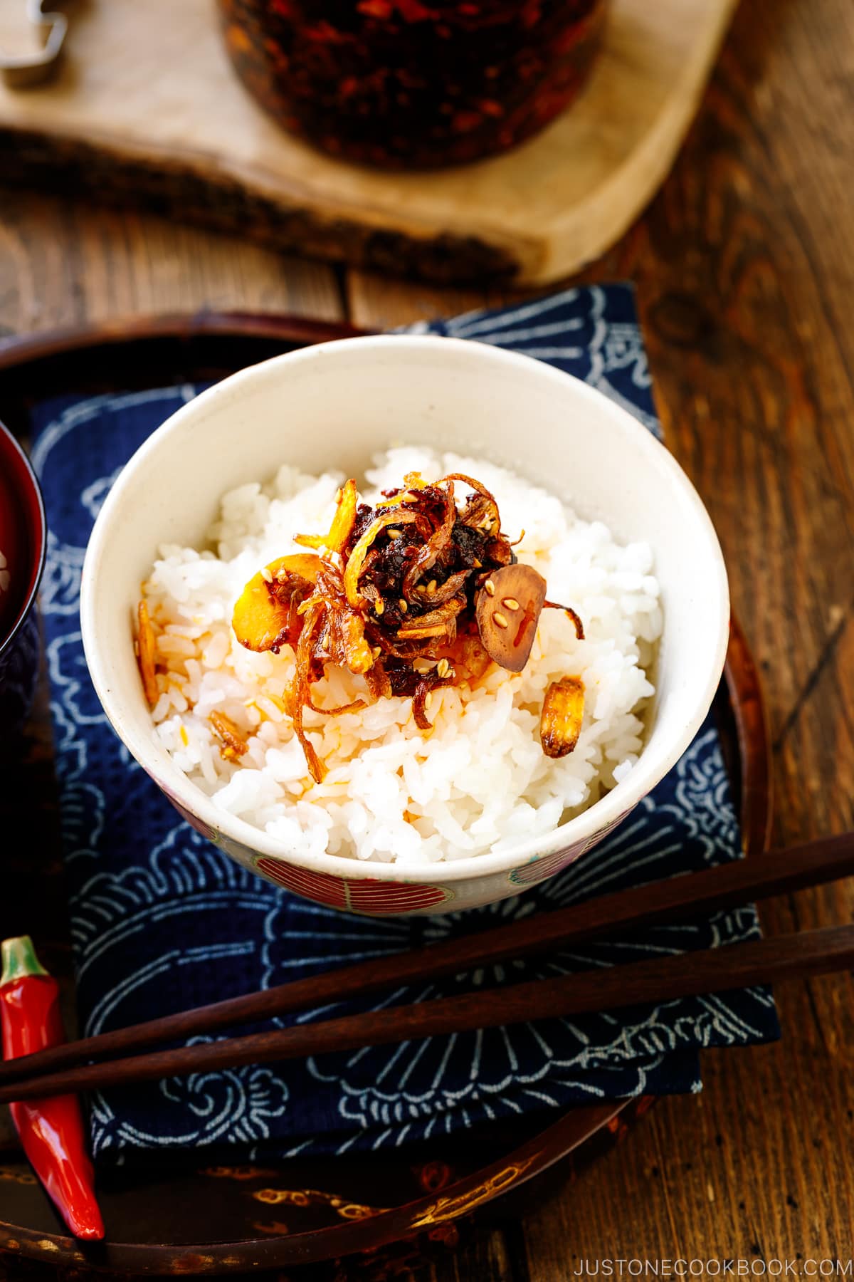 A Japanese rice bowl containing steamed rice topped with Crunchy Garlic Chili Oil.