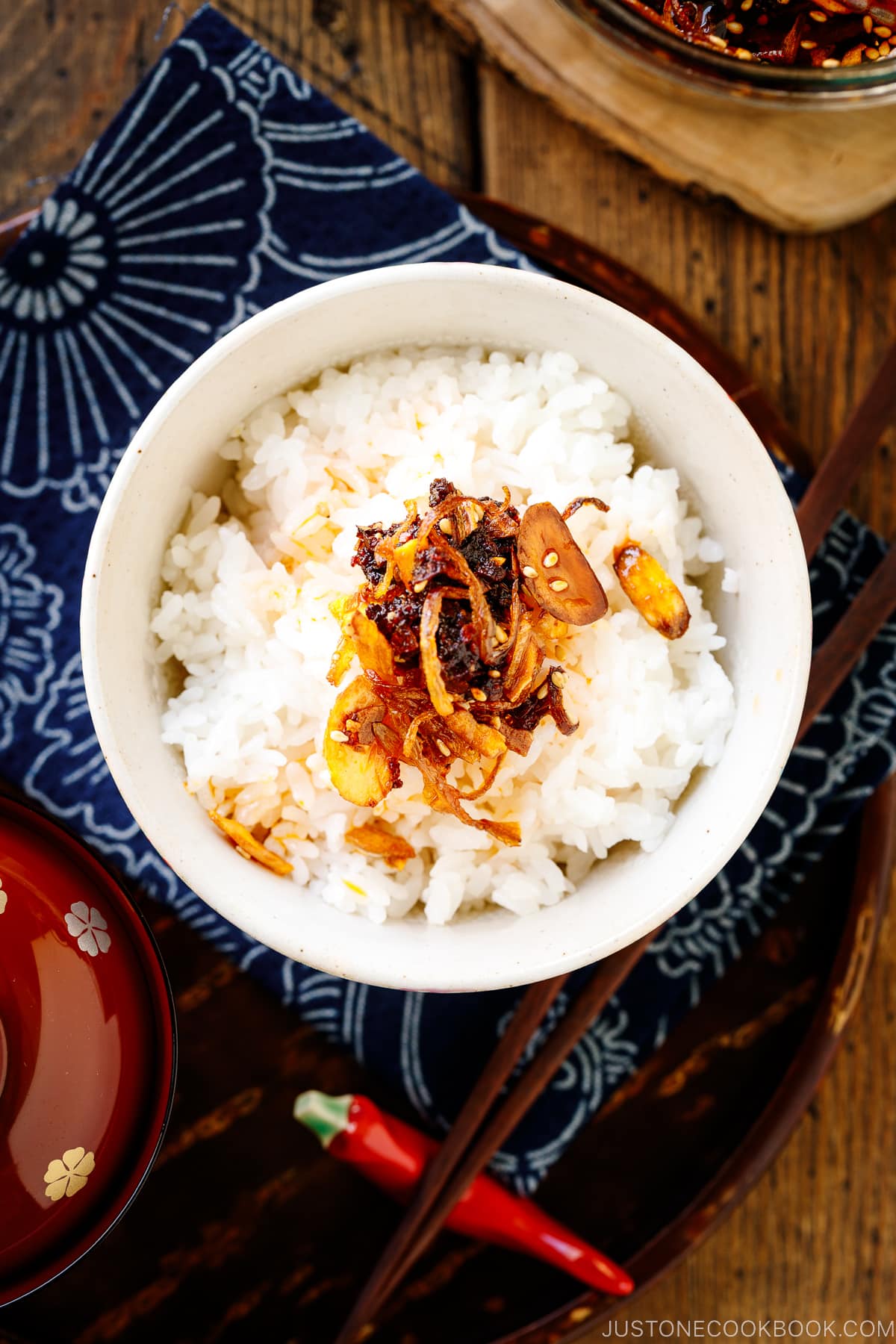 A Japanese rice bowl containing steamed rice topped with Crunchy Garlic Chili Oil.