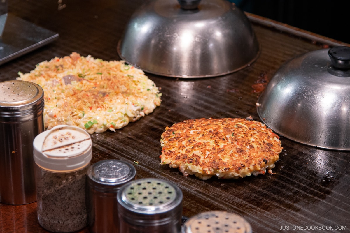 Okonomiyaki cooking on skillet