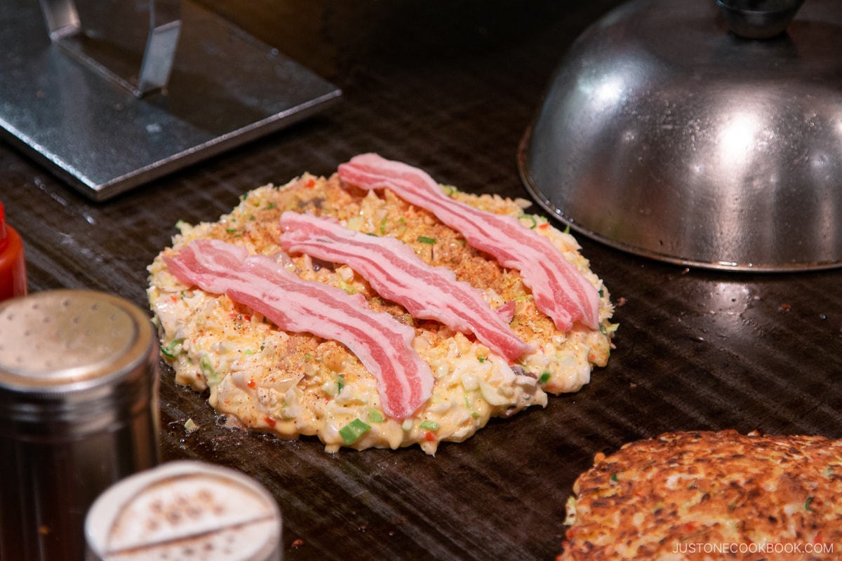 okonomiyaki cooking on skillet