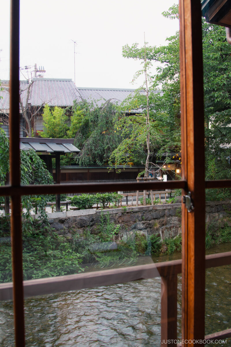 looking out the restaurant window at a canal