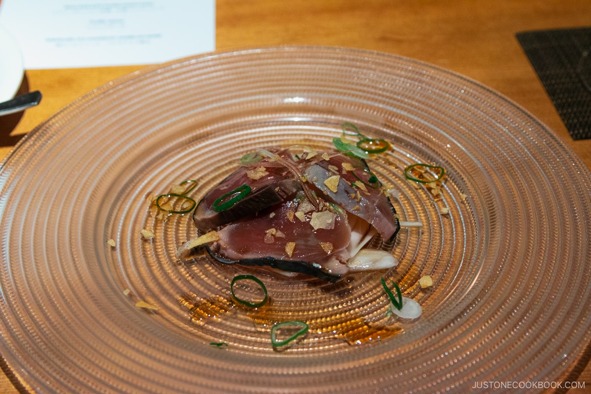 bonito sashimi on a glass plate