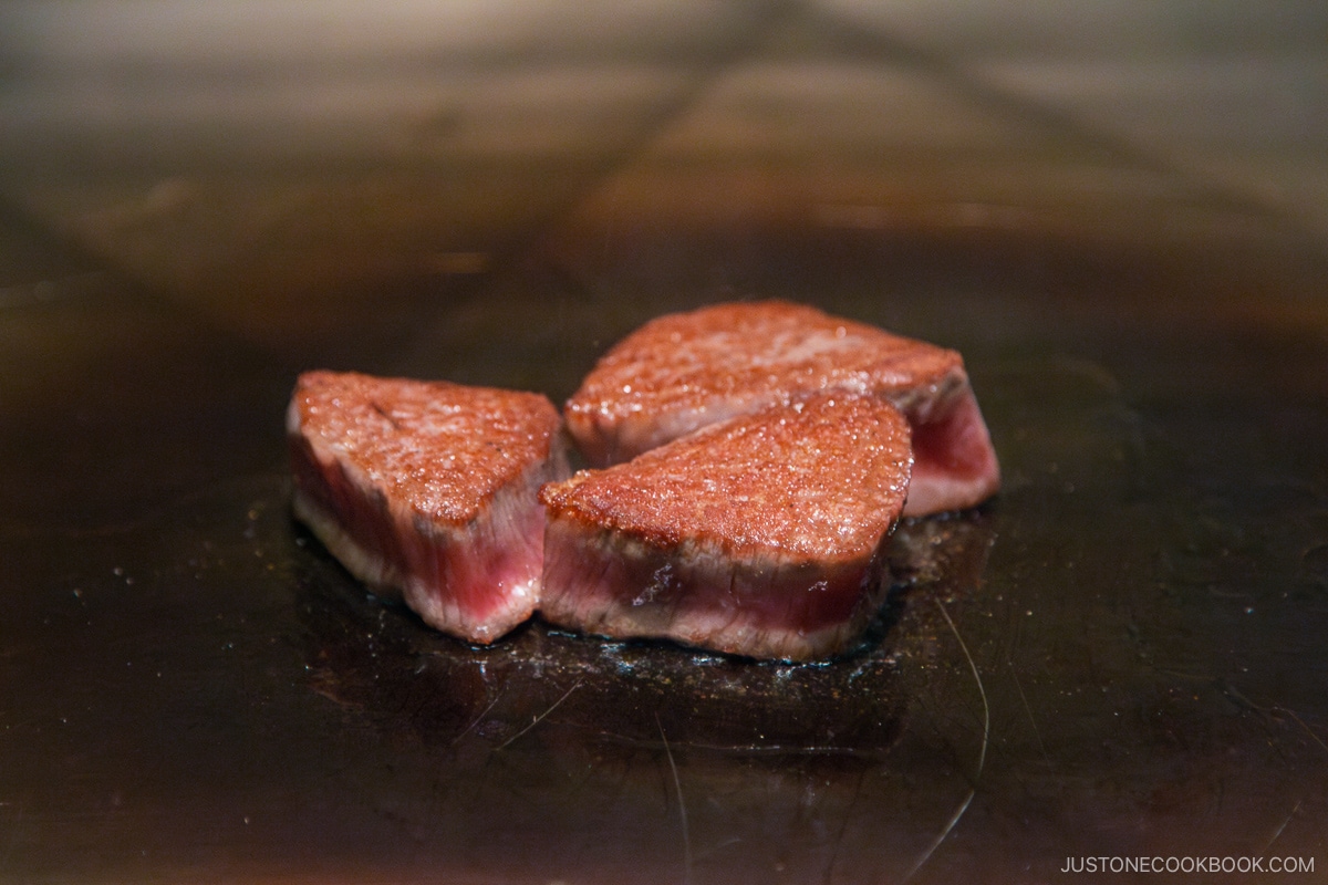wagyu steak cooking on a skillet