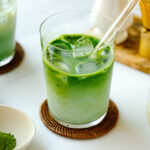 Tall glass cups containing Iced Matcha Latte.