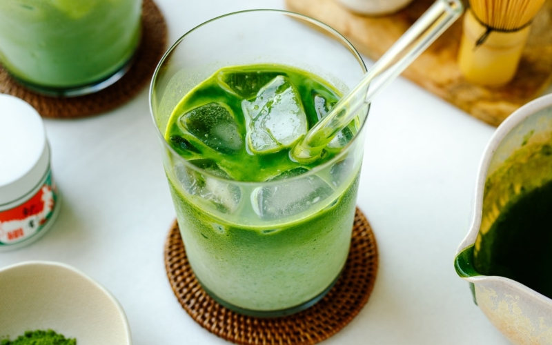 Tall glass cups containing Iced Matcha Latte.
