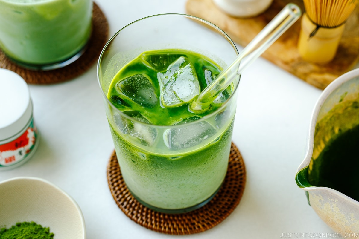 Tall glass cups containing Iced Matcha Latte.