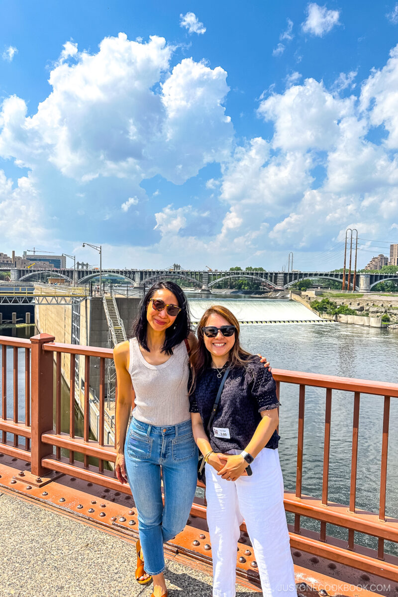 two women in front of St Anthony Falls