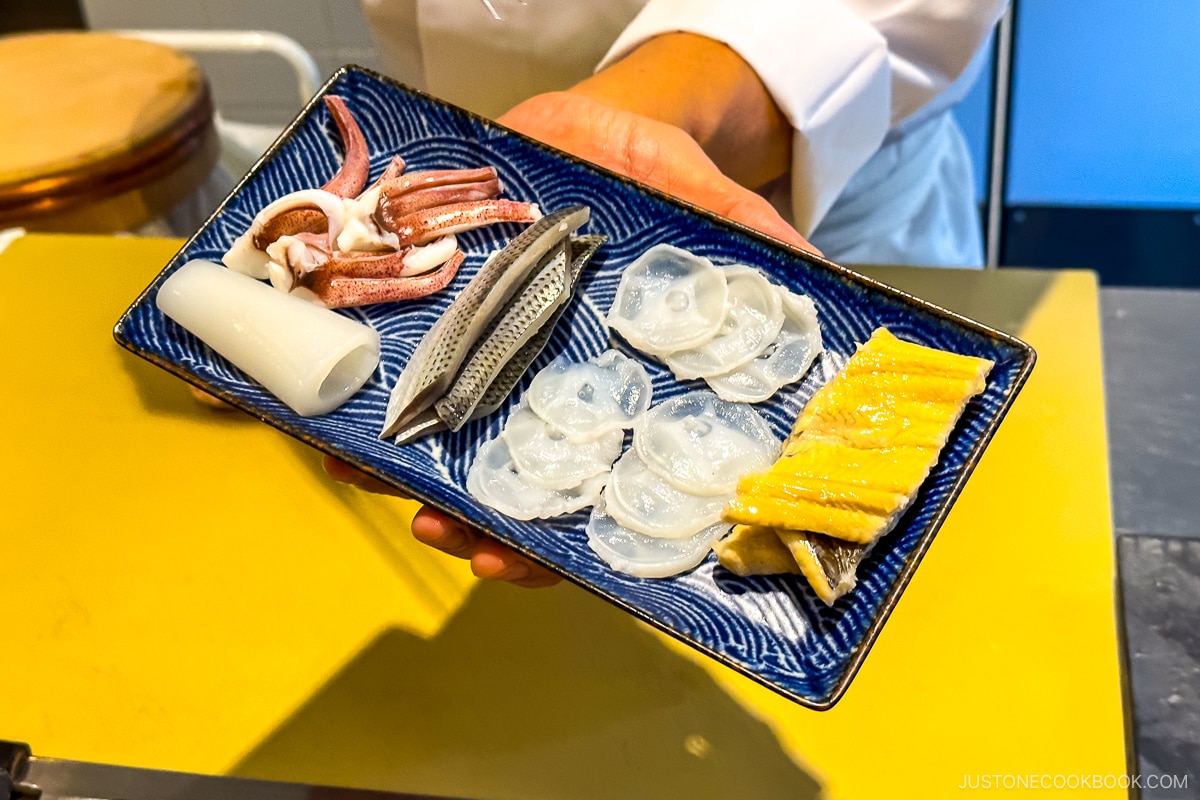 octopus and other fish on a blue plate