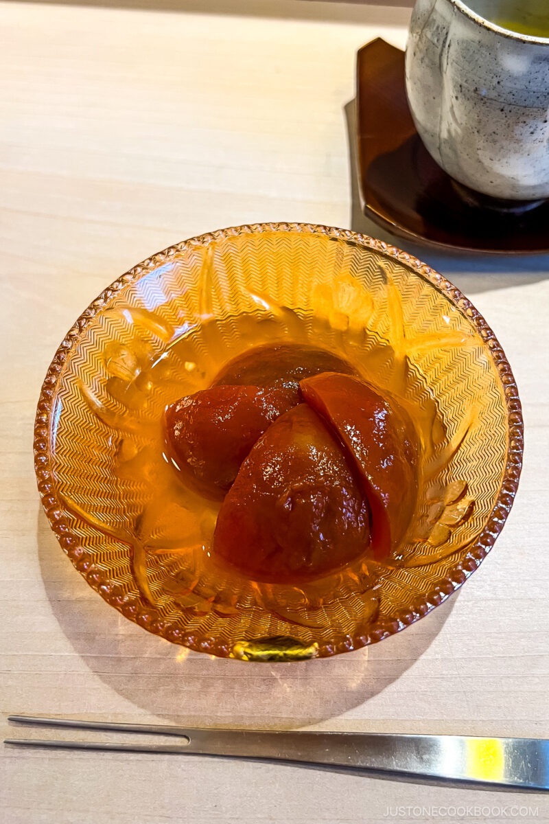 tomato cooked in syrup in a glass bowl