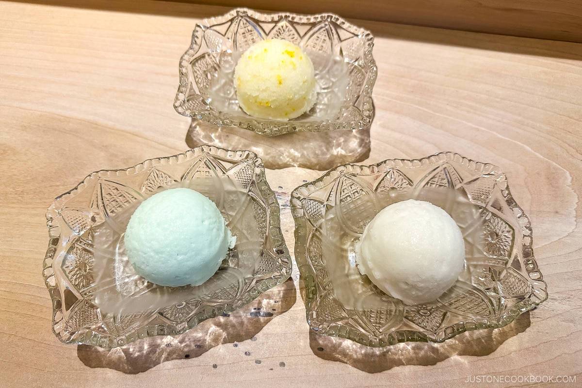 three different kinds of sorbet in glass bowls