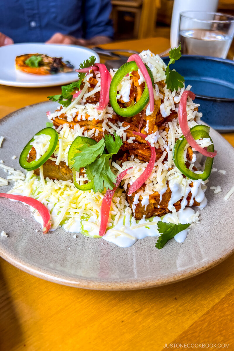 totchos with salsa taquera, white cheddar, jalapeño, crema, pickled red onion