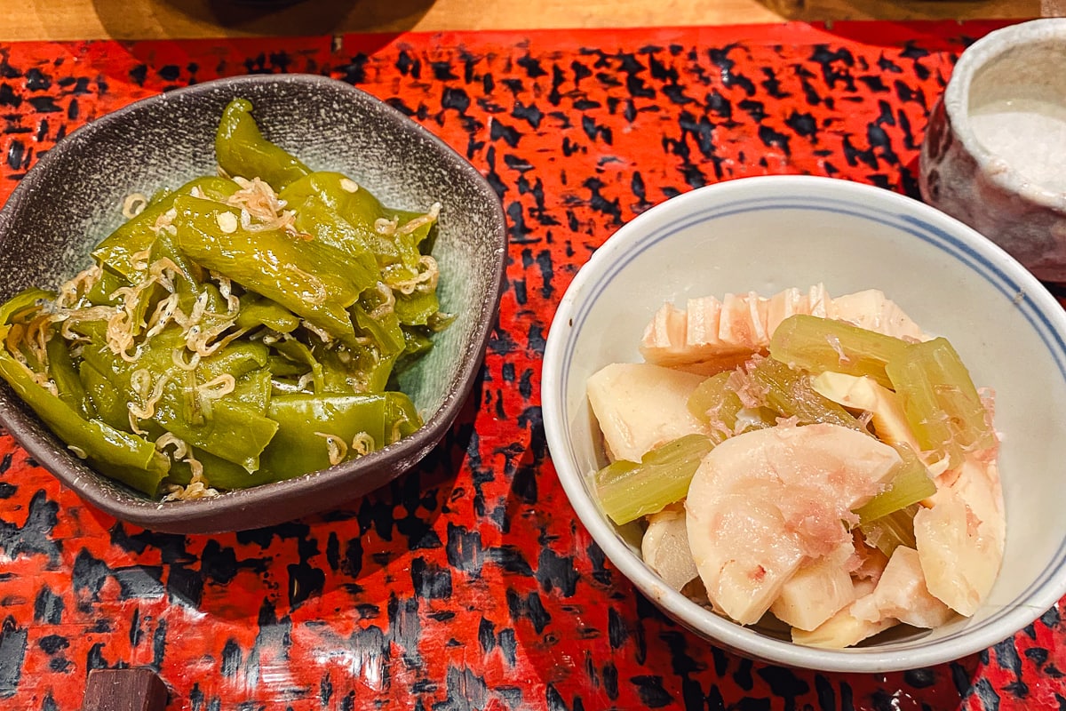 two bowls of vegetables on a table