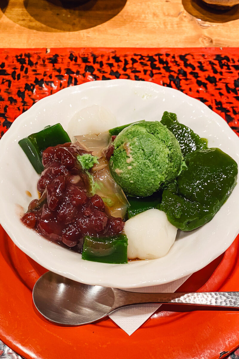 matcha ice with sweets in a white bowl